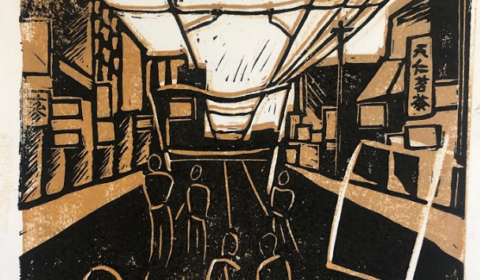 Linocut in black, ochre and white of people marching on the street through Chinatown Toronto with the road in perspective at the centre. On the right there is a sign in Chinese characters, there is an outline of a placard in the foreground.